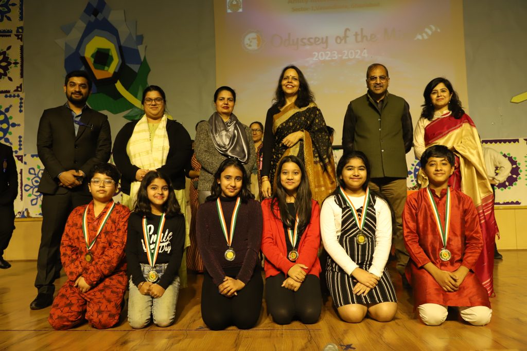 Young innovators celebrating teamwork and achievement at Odyssey of the Mind event